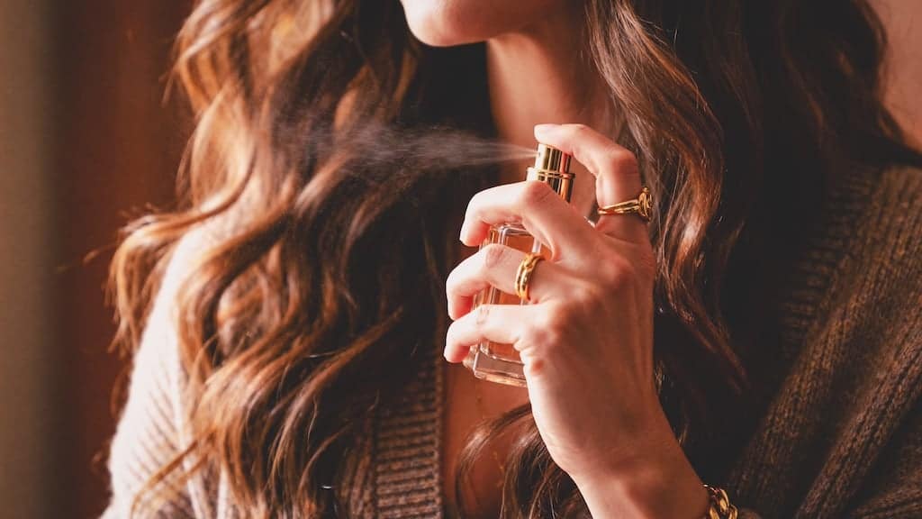 Close-up,Shot,Of,A,Woman,With,Voluminous,Brown,Hair,Spraying